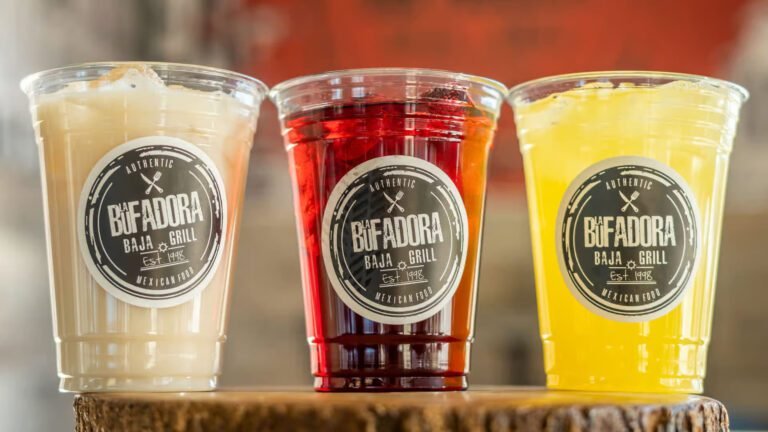 3 drinks side by side with a logo sticker imprinted on each