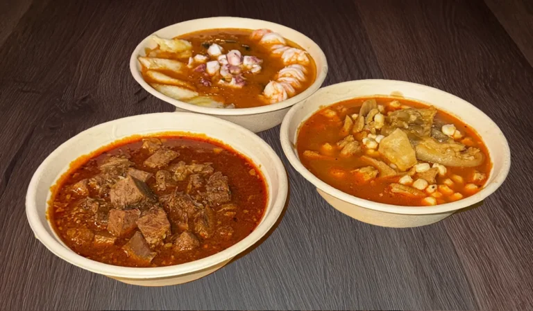 3 deliciously prepared soups sitting side by side on a table